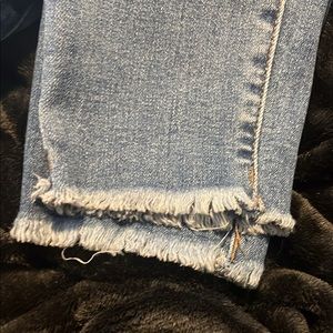 Skinny blue jeans with no cuts in the jeans